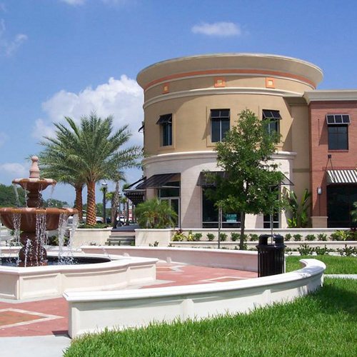 Commercial building with fountain and landscaping in Winter Springs, FL, representing The Green Bucket's eco-friendly commercial cleaning services.