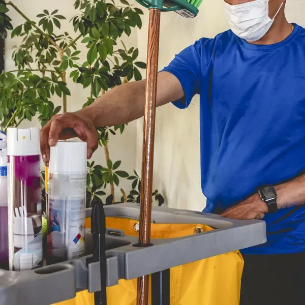 Business owner budgeting for cleaning services in a cozy office environment